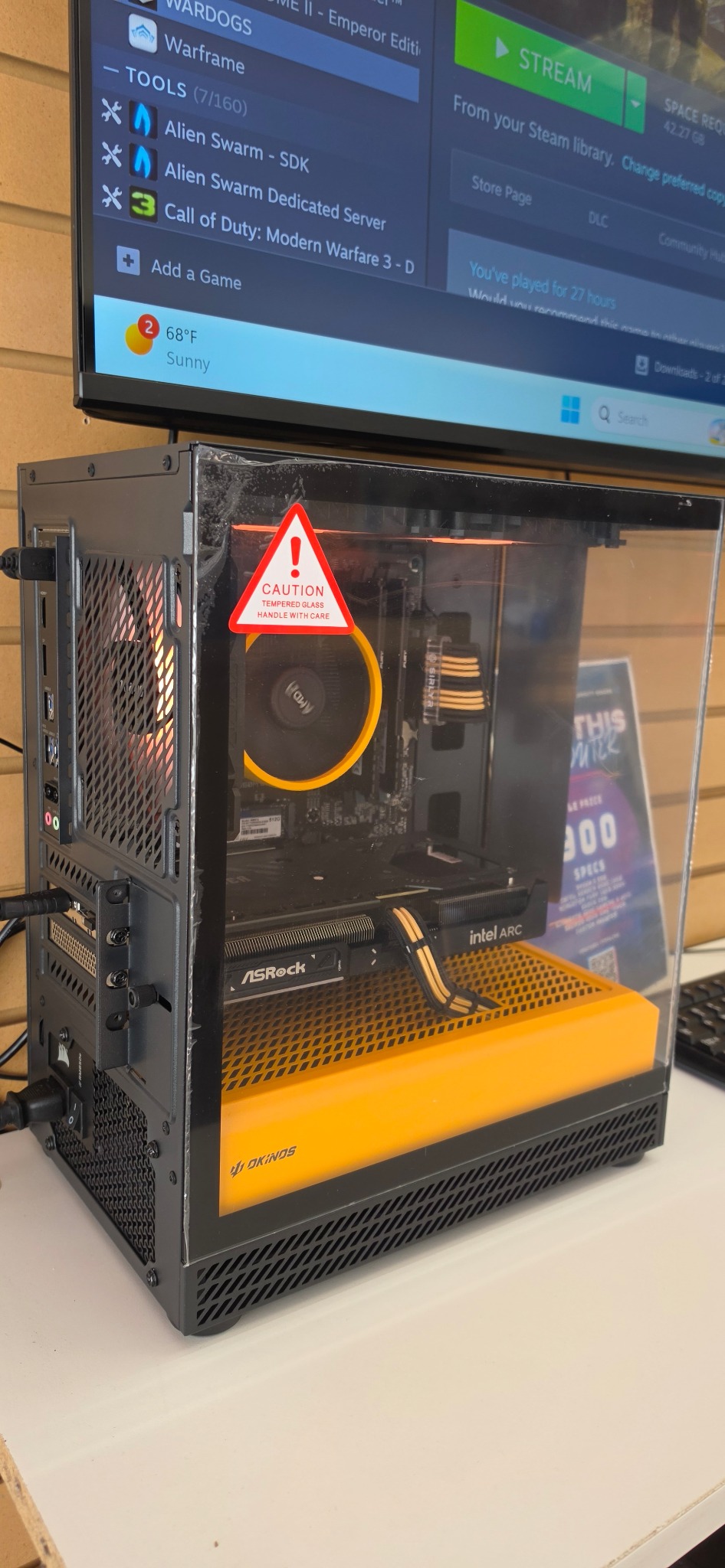 Black and yellow custom gaming PC built by FPS4Less