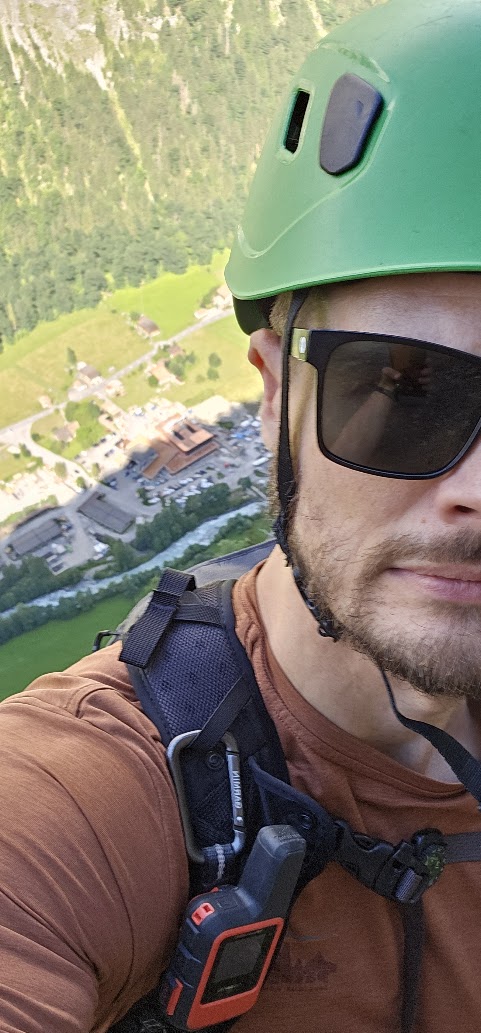 Danny outdoors in a climbing helmet